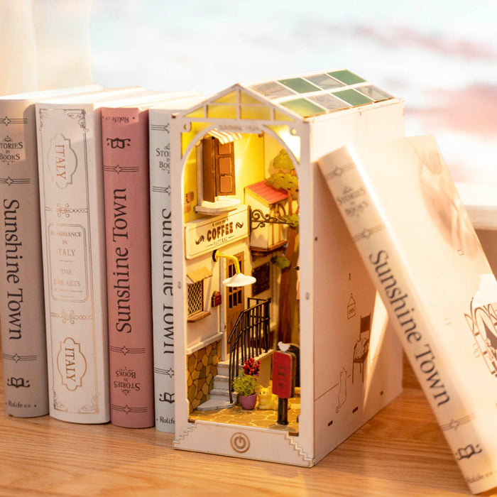 Rolife Sunshine Town book nook showing Mediterranean alley scene with tiled stairs and balcony between matching hardcover books