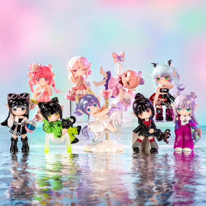 Rolife Suri's Colorful Girls SKXX full collection of nine fantasy girl figures standing in shallow water under a rainbow sky with clouds and bokeh lighting