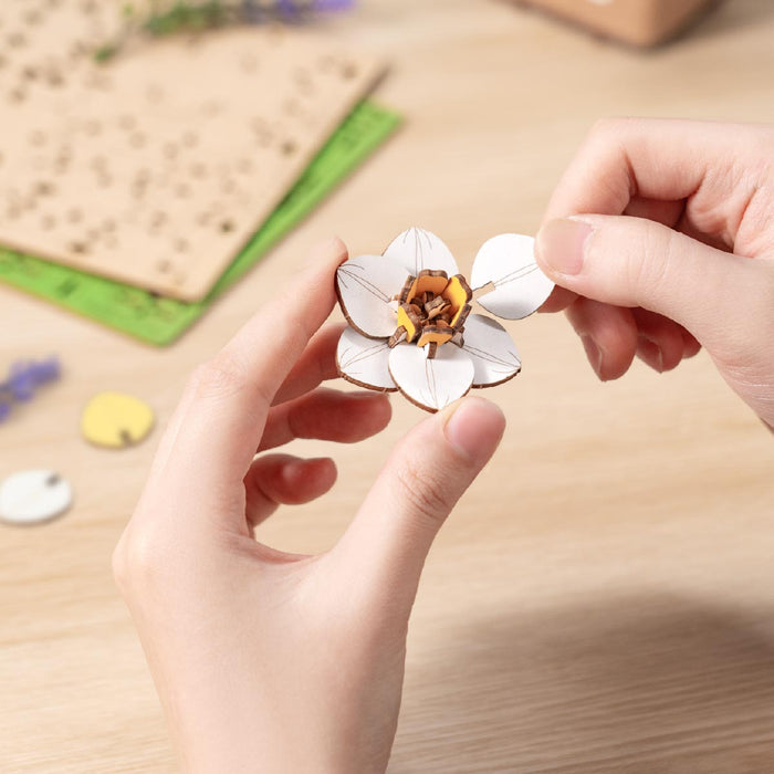 Rowood Narcissus Flower Bouquet Wooden 3D Puzzle TF002 3D wooden flower puzzle, parts and pieces laid out before assembly