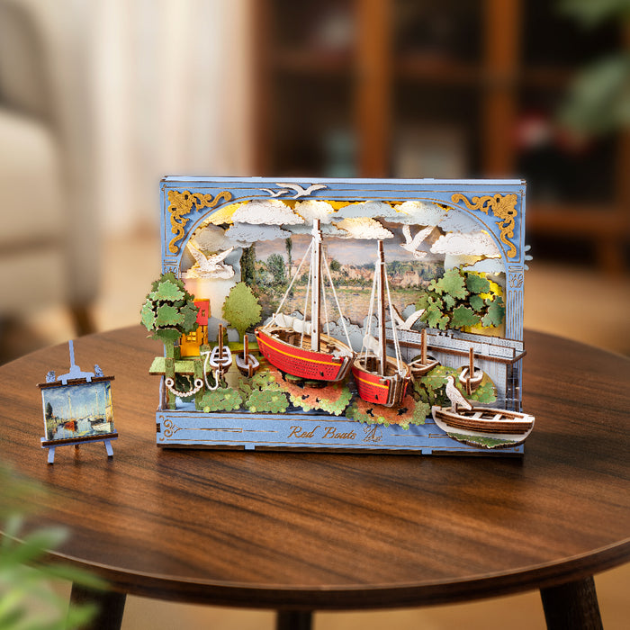 Rolife Red Boats 3D art frame displayed upright on a round wooden coffee table in a bright living room