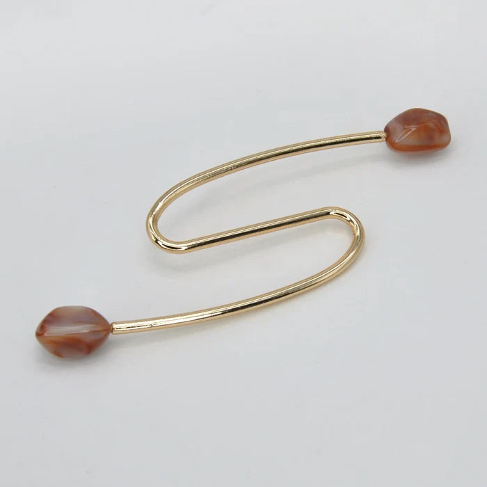 S-Shaped Buckle with Amber Accents Design