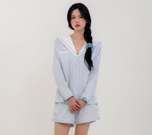 Front View
Woman wearing PEKGEE Sailorette Frosted Petals handmade premium cotton pyjama set.
