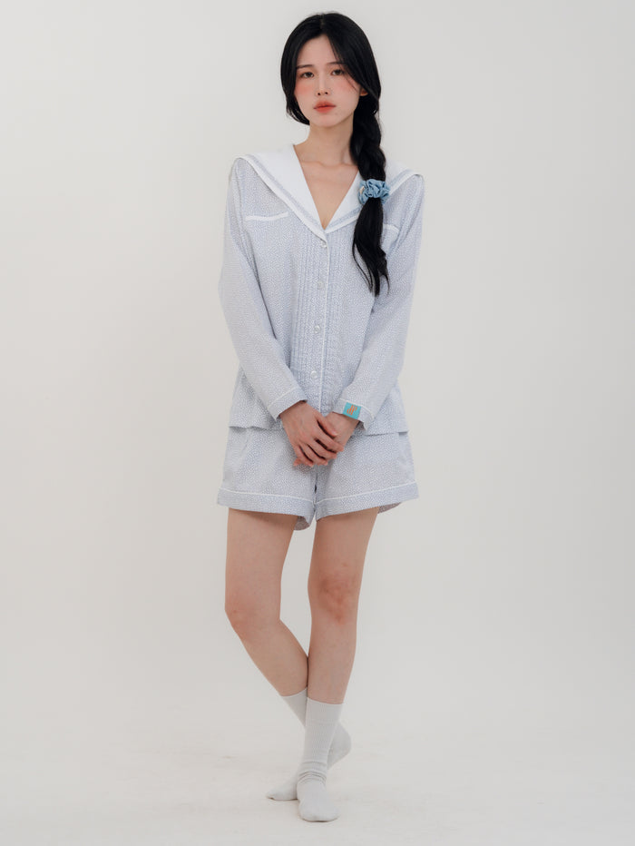 Front View
Woman wearing PEKGEE Sailorette Frosted Petals handmade premium cotton pyjama set.