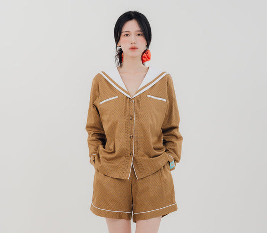 Front view Woman wearing PEKGEE Sailorette Golden Hour handmade premium cotton pyjama set.