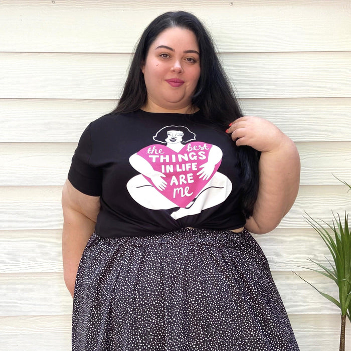 Black Viscose T-shirt featuring the slogan "Simply the Best" in bold, white and pink retro-style font across the chest.