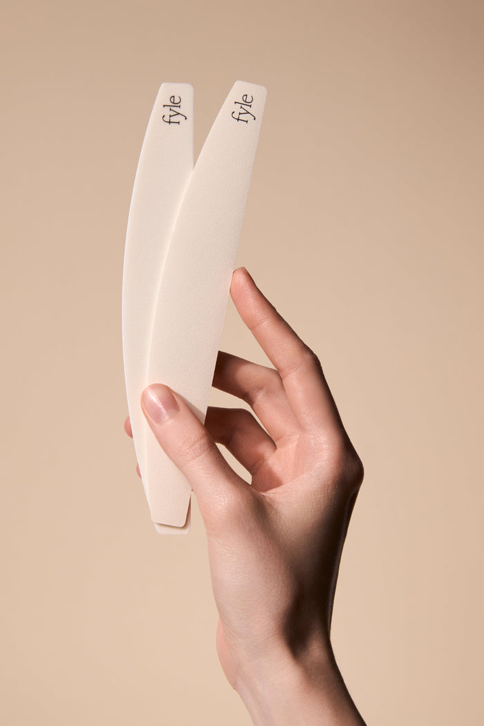 Two Fyle Filing Strips held in hand