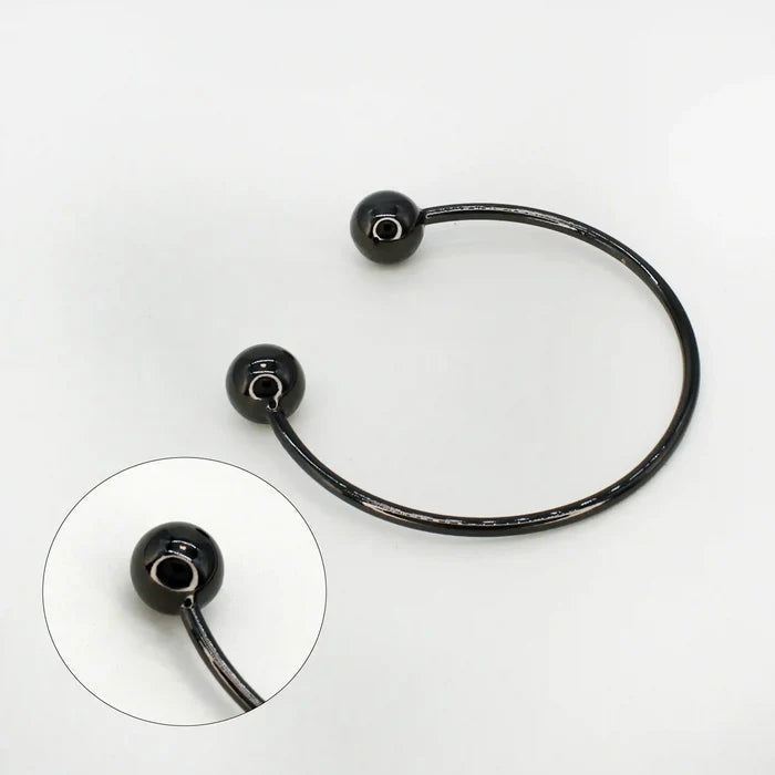 Ani Accessories Timeless Round Black Metal Buckle zooming image on the tip of  the buckle to show the buckle in the white background.
