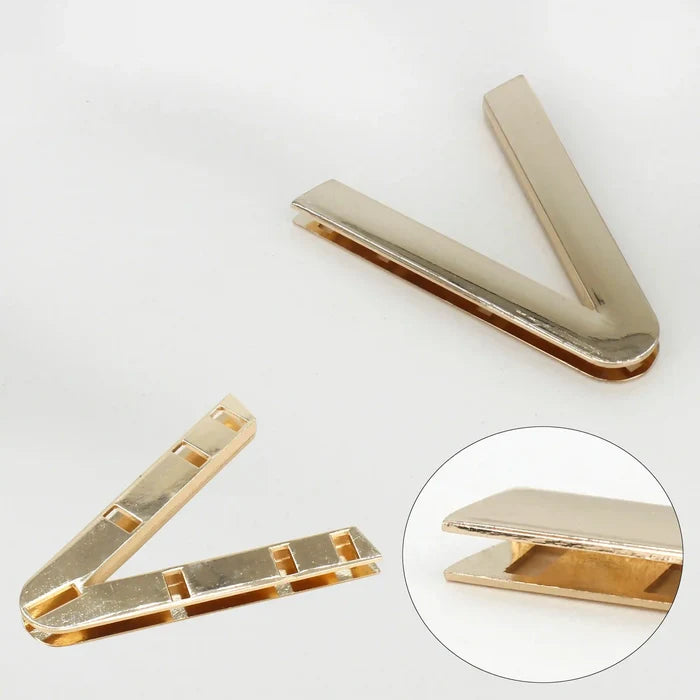 Ani Accessories V-Shaped Elegant Metal  gold Buckle in back side and focus zooming in focus in tip of the gold buckle in a white background.